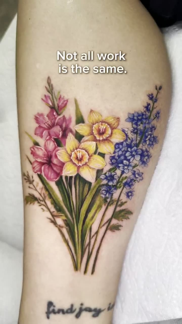Video of a colour floral tattoo on the forearm