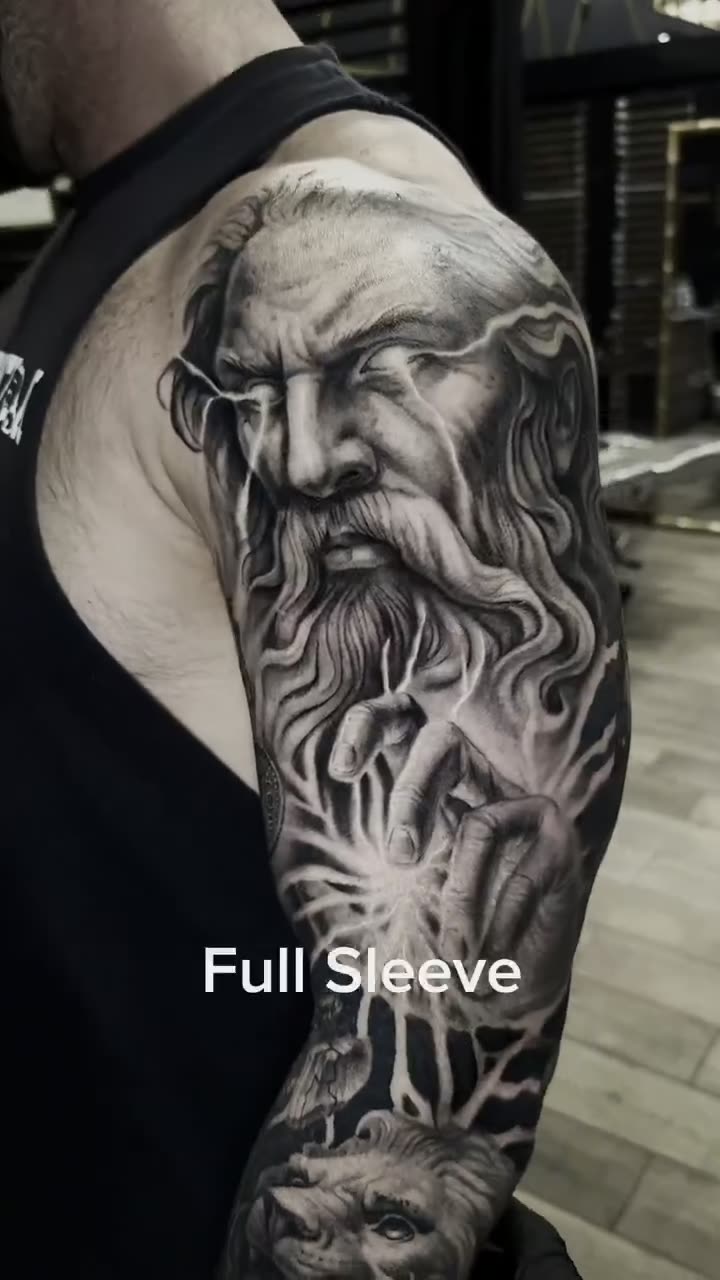 Video of a completed black and grey full sleeve tattoo
